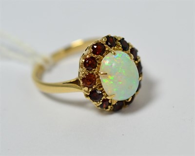 Lot 185 - A 9ct gold opal and garnet cluster ring