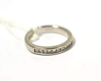 Lot 187 - A platinum princess cut diamond half eternity ring