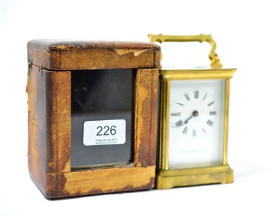 Lot 226 - A brass carriage clock by C E Court, Ulverston, Kendal with fitted case