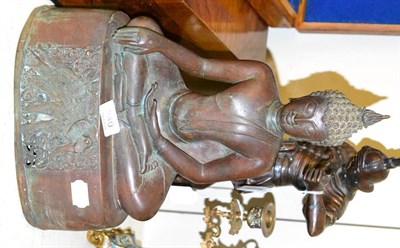 Lot 240 - A decorative bronzed figure of a seated Buddha, on plinth base