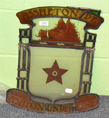 Lot 243 - A Victorian Ashton Under Lyme stained glass panel decorated with a crest of a boar's head