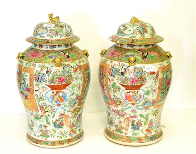 Lot 276 - A pair of 19th century famille rose baluster jars and covers (a.f. drilled)