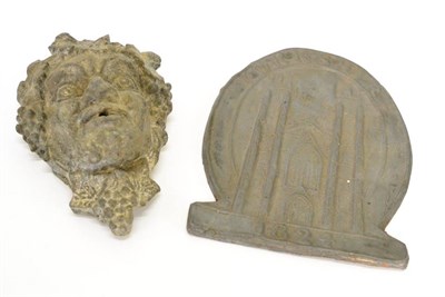 Lot 278 - A lead bacchic mask, a reproduction Yorkshire 1824 fire plaque and a plaster lion mask fountain...