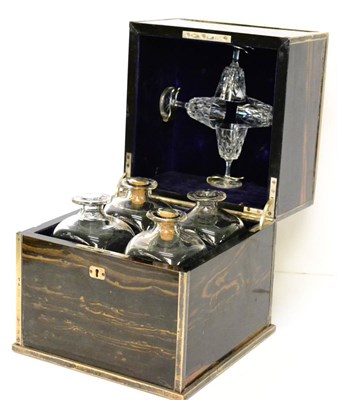 Lot 283 - A Victorian silver mounted four bottle decanter case