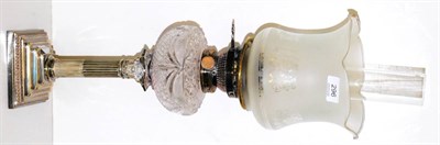 Lot 296 - A 19th century columnar silver plated oil lamp with etched glass shade and cut glass reservoir