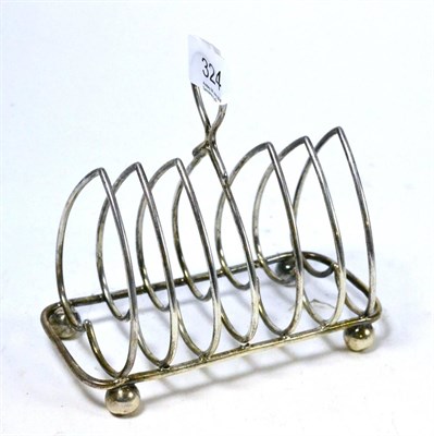 Lot 324 - A silver six division toast rack