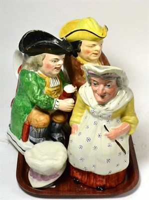 Lot 347 - Three toby jugs; two modelled as gentlemen, the other as a woman