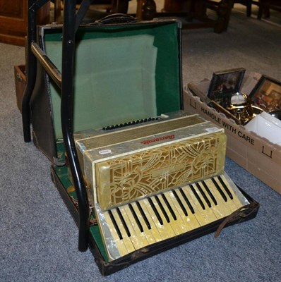 Lot 1041 - A piano accordion, a child's sewing machine and a cased dumpy level