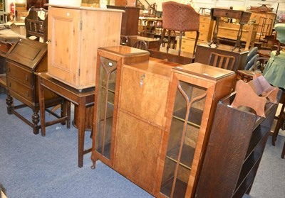 Lot 1045 - A quantity of furniture including a 1950s display cabinet with fall front writing compartment,...