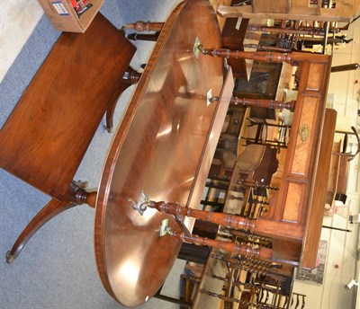 Lot 1053 - A reproduction dining table with matching bow fronted sideboard and a walnut washstand