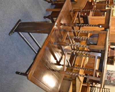 Lot 1059 - A 1920s oak drop leaf dining table and two barley twist occasional tables of similar date