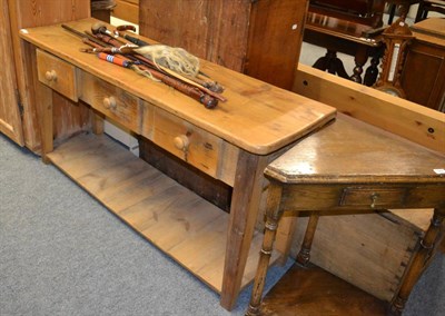 Lot 1065 - A pine farmhouse dresser base fitted with three drawers