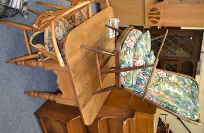 Lot 1072 - Two Ercol armchairs, an Ercol high back chair and an Ercol shelved cupboard (4)