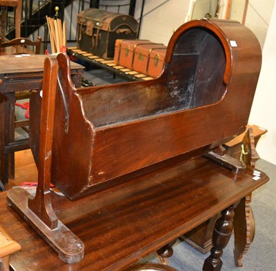 Lot 1076 - A Victorian mahogany cradle on trestle base