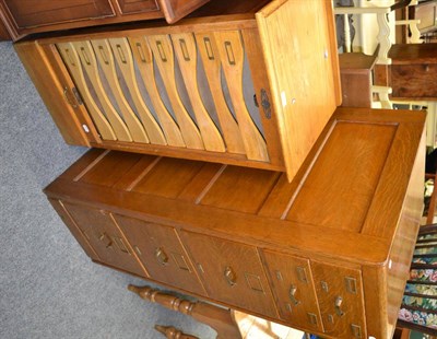 Lot 1081 - An early 20th century oak tambour fronted cabinet fitted with nine slides and an oak filing cabinet