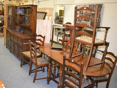 Lot 1083 - A Jacobean style oak dresser, corner cupboard, table and set of chairs made by J C (9)