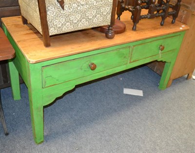 Lot 1085 - A pine table fitted with two drawers