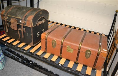 Lot 1091 - A vintage dome top trunk together with a vintage wooden bound trunk