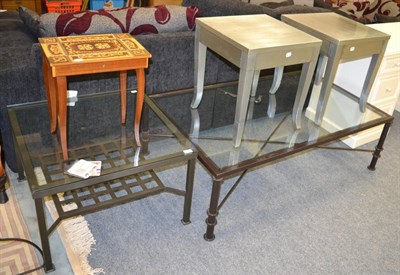 Lot 1138 - A large glass topped coffee table, another smaller, two metallic side tables, three framed and...