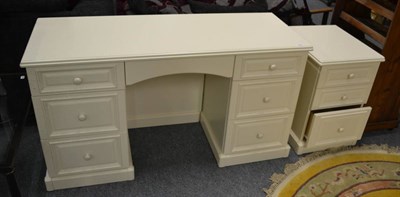 Lot 1139 - A Lawrence Walsh Haverford soft cream lacquer dressing table and bedside chest