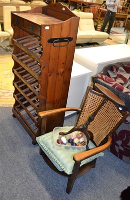 Lot 1140 - A wine table, a nursing chair, a pine wine rack, hardstone eggs and a circular Chinese rug with...