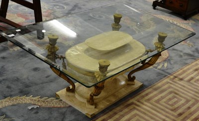 Lot 1144 - A composition period style glass top pedestal table decorated with swags and scrolls