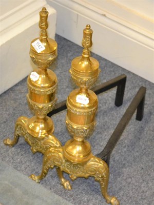 Lot 1147 - A pair of brass fire dogs