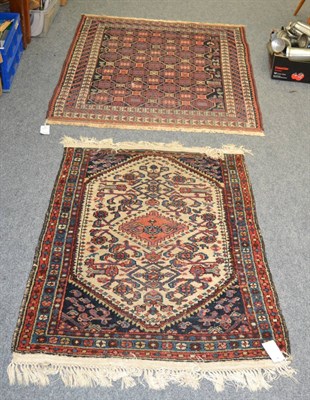 Lot 1155 - An Afshar rug, South East Iran, The honeycomb lattice field of hooked guls enclosed by triple arrow