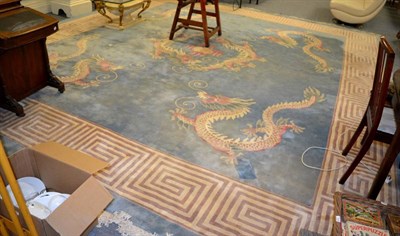 Lot 1156 - Large Chinese carpet, The ice blue field centred by fighting dragons, the spandrels with...