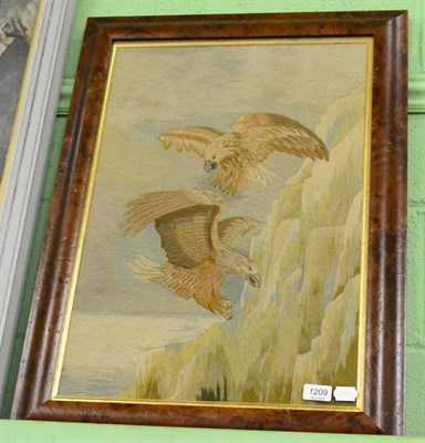 Lot 1209 - A 19th century woolwork of two eagles fighting beside a cliff