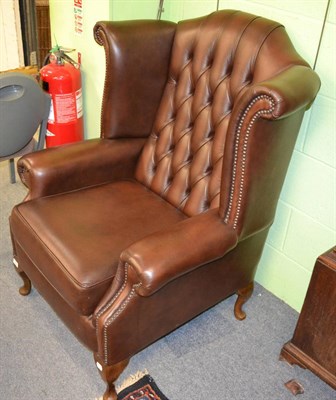 Lot 1244 - A modern leather button back chair