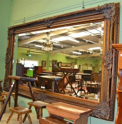 Lot 1253 - A large gilt framed mirror with bevelled rectangular mirror plate (a.f.)