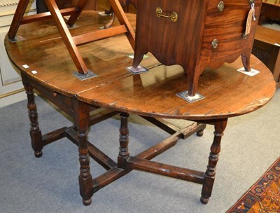 Lot 1258 - An 18th century and later oak gateleg table, two drawers