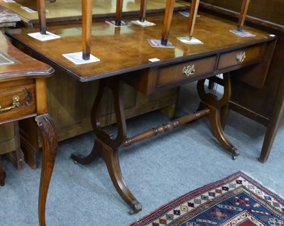 Lot 1273 - A reproduction drop leaf sofa table with lyre form base