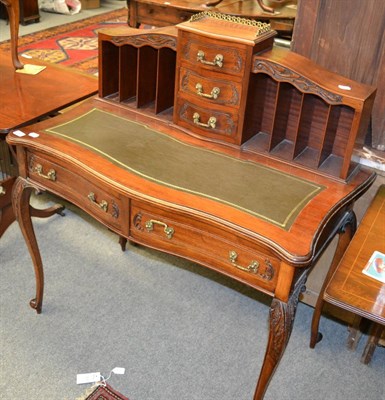 Lot 1275 - A French style leather inset mahogany writing desk