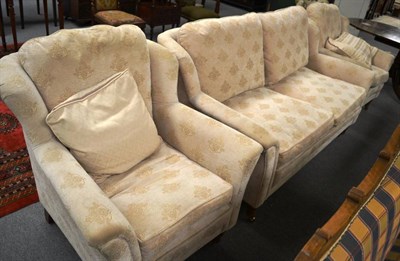 Lot 1292 - A cream upholstered three piece suite