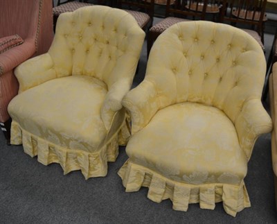 Lot 1300 - A Victorian button back armchair with gold brocade upholstery and matching ladies chair