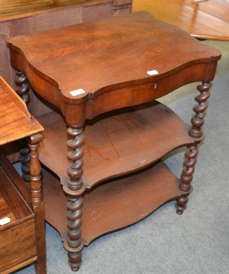 Lot 1323 - A Victorian mahogany work table with two shelf sections supported on boldly turned uprights