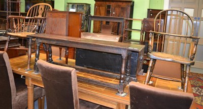 Lot 1330 - A 19th century elm Windsor chair with crinoline stretcher and a similar hoop back example