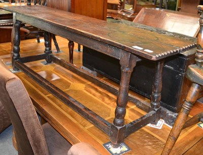 Lot 1331 - Oak form raised on turned legs with H stretcher