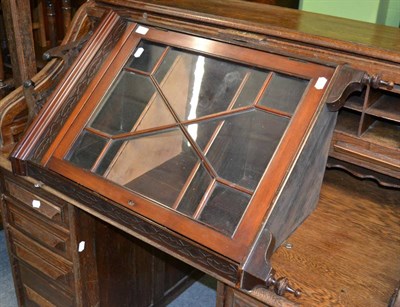 Lot 1336 - A glazed mahogany hanging corner cupboard