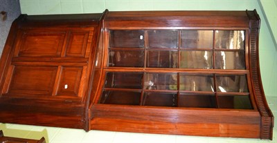 Lot 1353 - A mahogany standing corner cupboard, the upper section with concave glazed doors flanked by...