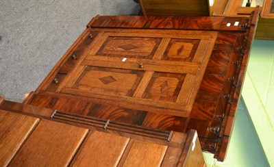 Lot 1355 - A good George III oak and mahogany panelled hanging corner cupboard fitted with drawers