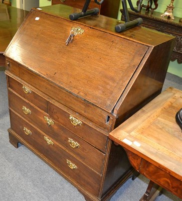 Lot 1363 - George III oak bureau