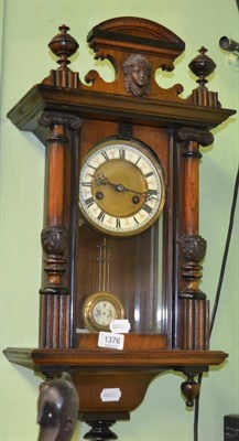 Lot 1376 - A Vienna style walnut wall clock, Roman dial, twin train movement, eight day, carved...