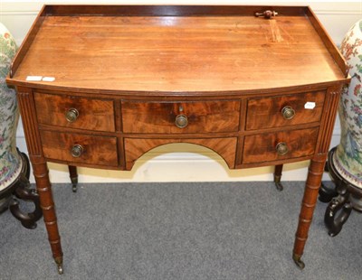 Lot 1377 - An early 19th century mahogany kneehole dressing table, 92cm wide, 75cm high