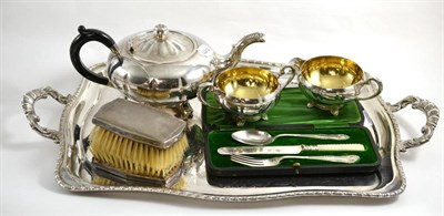 Lot 9 - A silver plated three piece tea service, a twin handled tray, two brushes and a Christening set