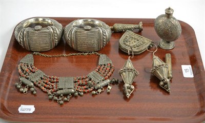 Lot 15 - A group of Middle Eastern white metal jewellery including anklets, coral necklace, purse, scent...