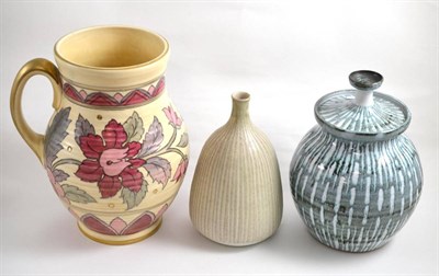 Lot 18 - A Peter Lane pottery jar and cover together with a bottle vase by the same hand and a Charlotte...