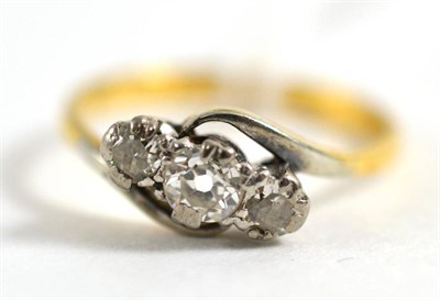 Lot 65 - A diamond three stone twist ring